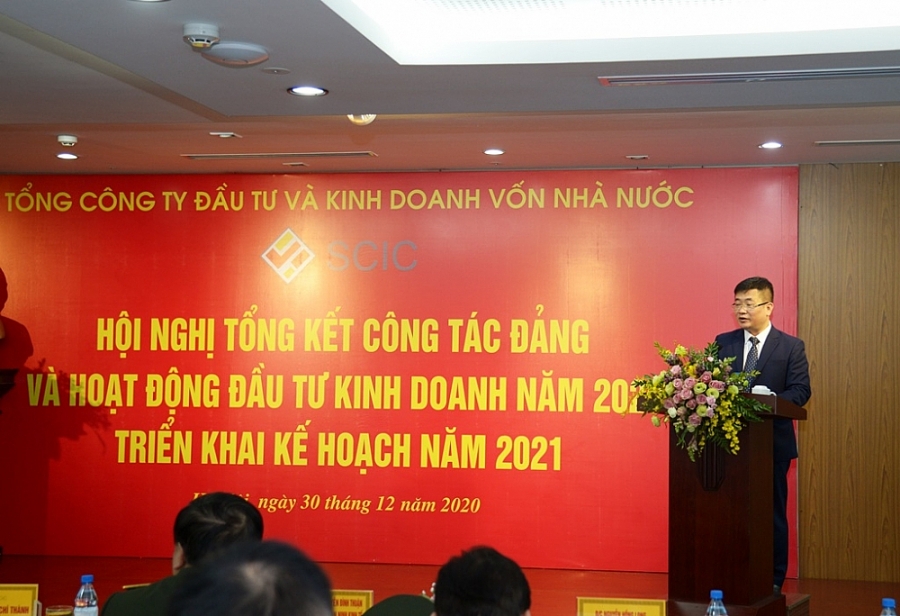 Đồng chí Đinh Việt Tùng – Phó Tổng giám đốc SCIC báo cáo kết quả hoạt động năm 2020 của Tổng công ty